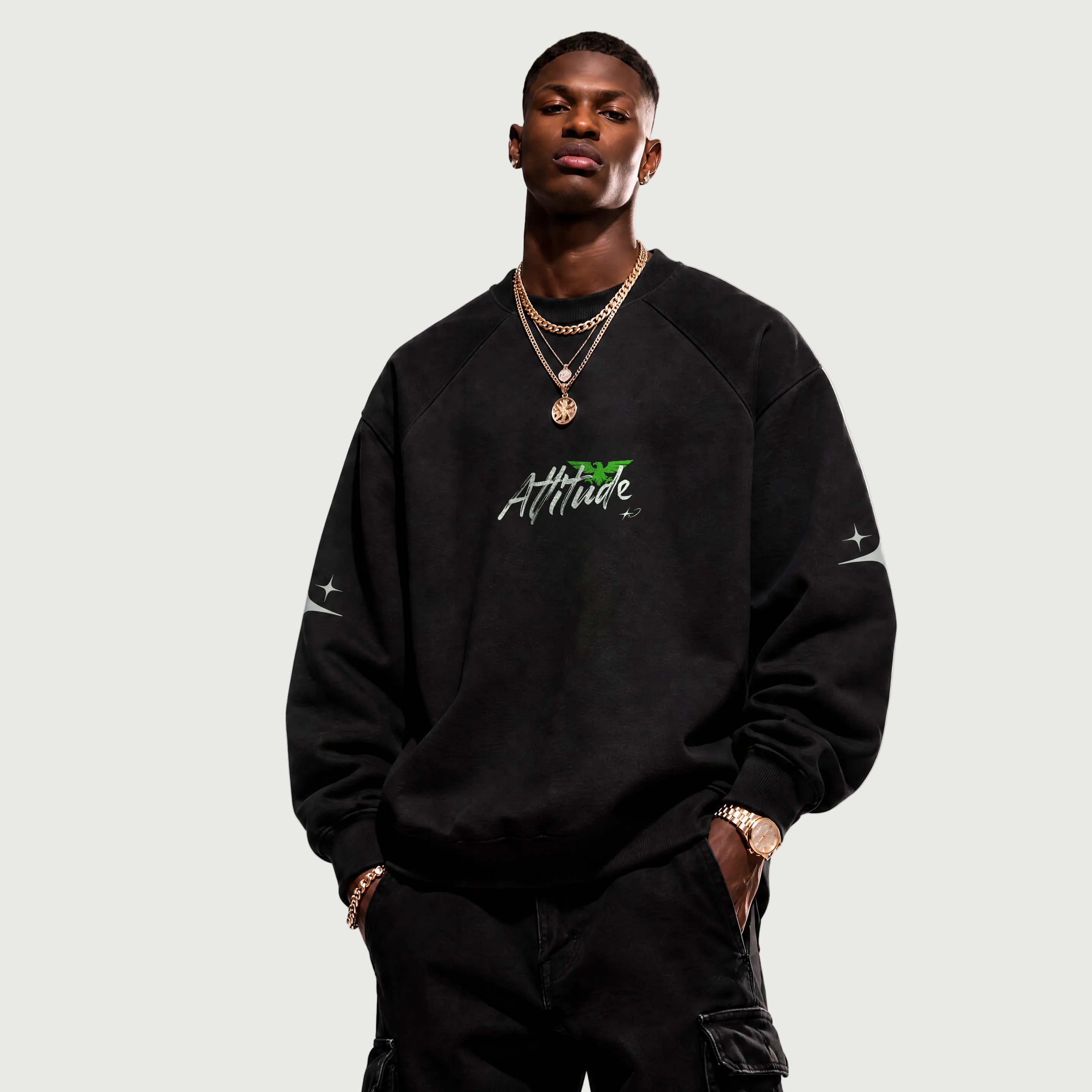 Man wearing a black sweatshirt with 'Attitude' text on a white background
