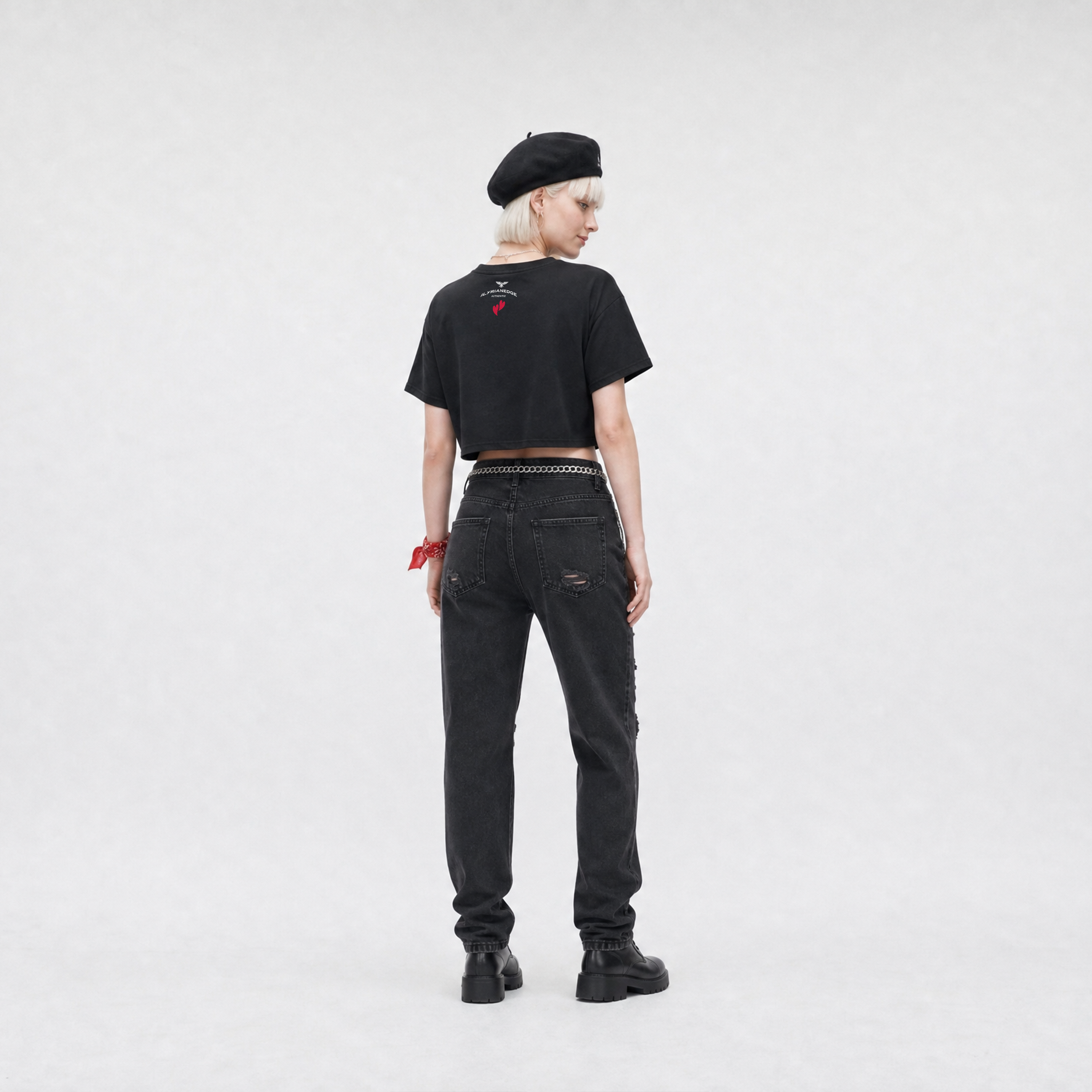 Person wearing a black t-shirt and jeans on a white background