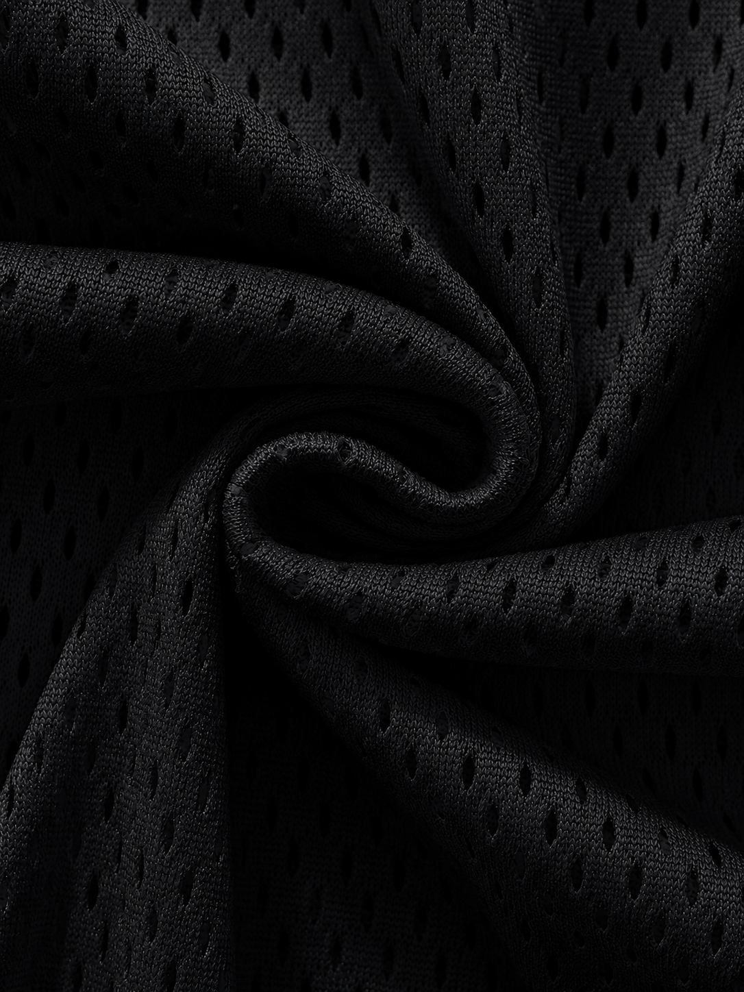 Close-up of black perforated fabric