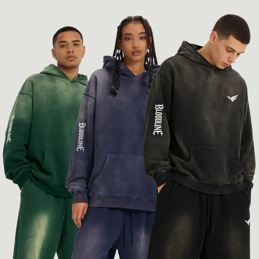Three people wearing hoodies and pants with a brand logo on a plain background