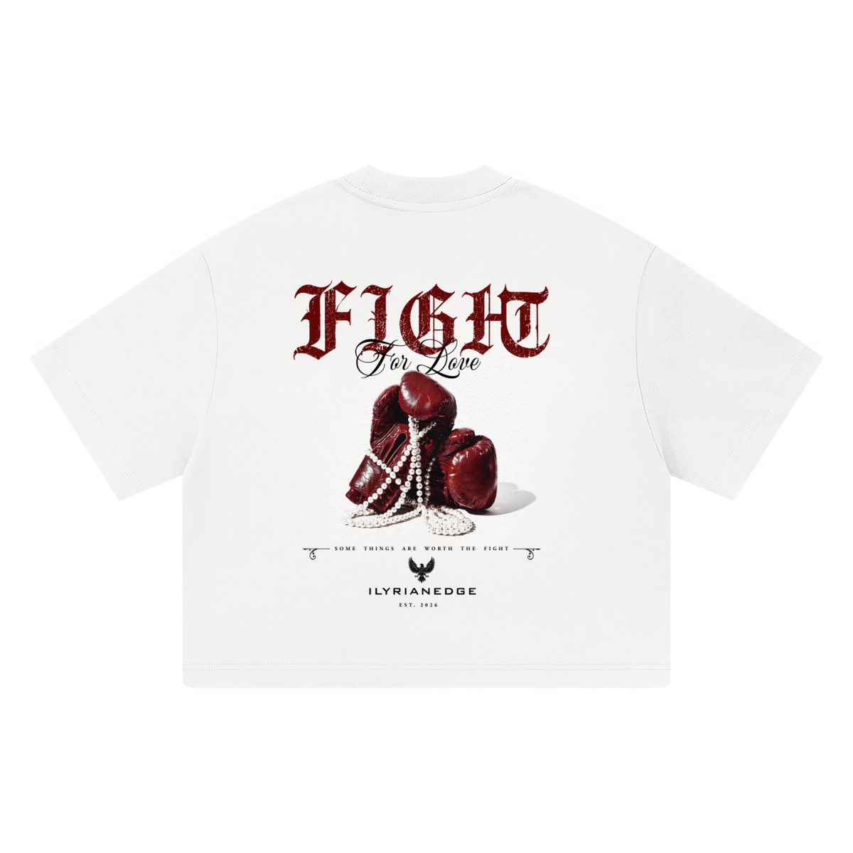 White short-sleeve t-shirt with a graphic print on the back featuring red boxing gloves, a pearl chain, the word 'FIGHT' in gothic red font, and the brand name 'ILTRIANCEEDGE' below.