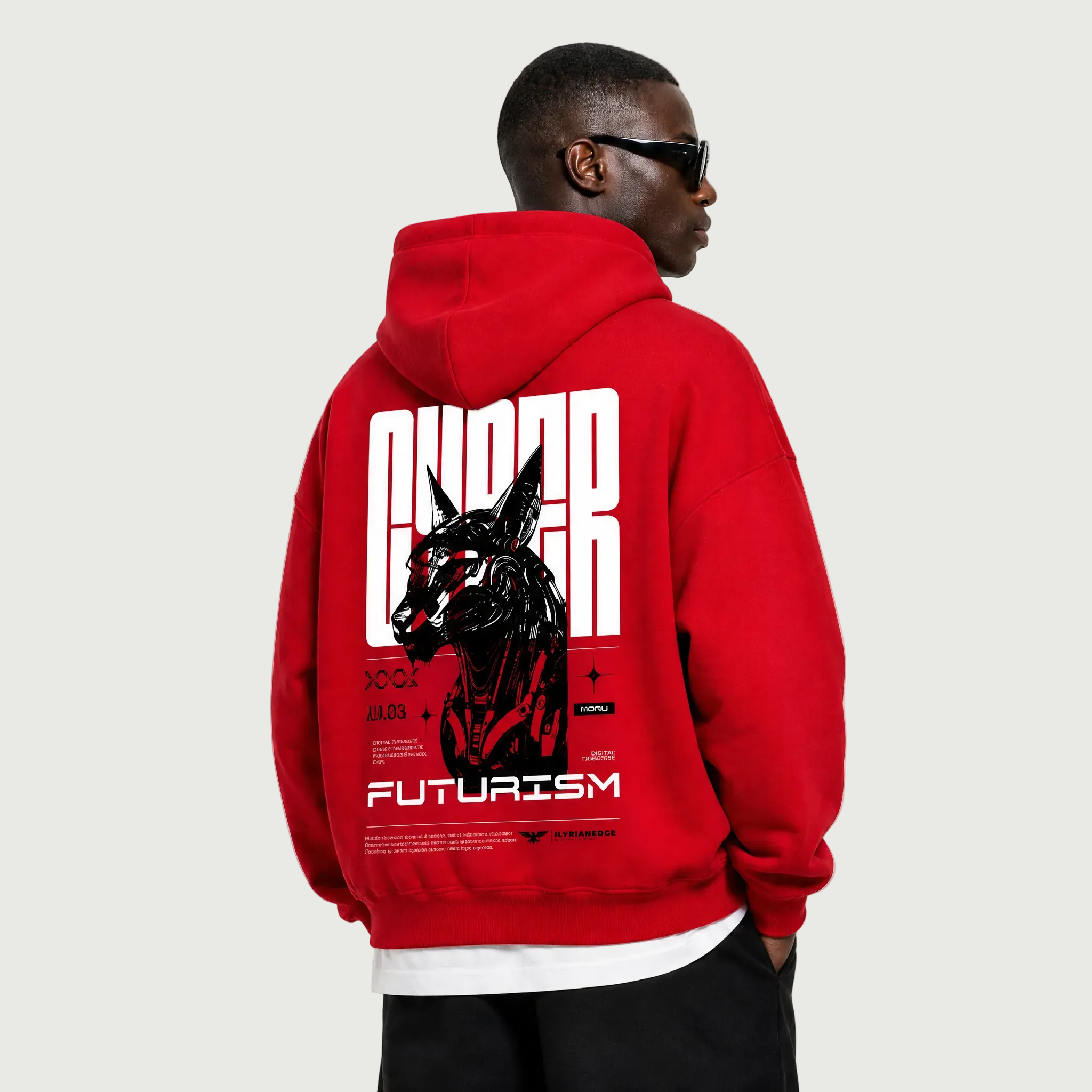 Person wearing a red hoodie with a graphic design on the back, standing against a white background